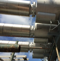 Installed exhaust silencers on an industrial stack