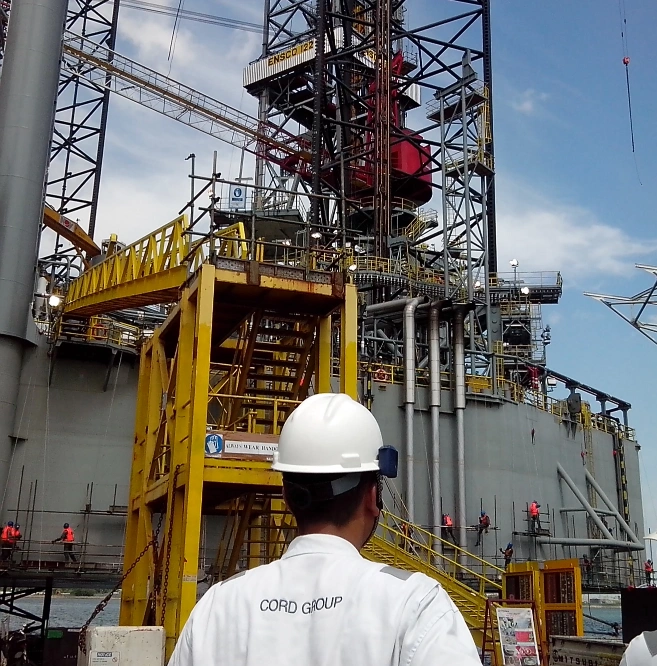 Cord Exhaust Engineering engineer overseeing an industrial exhaust installation