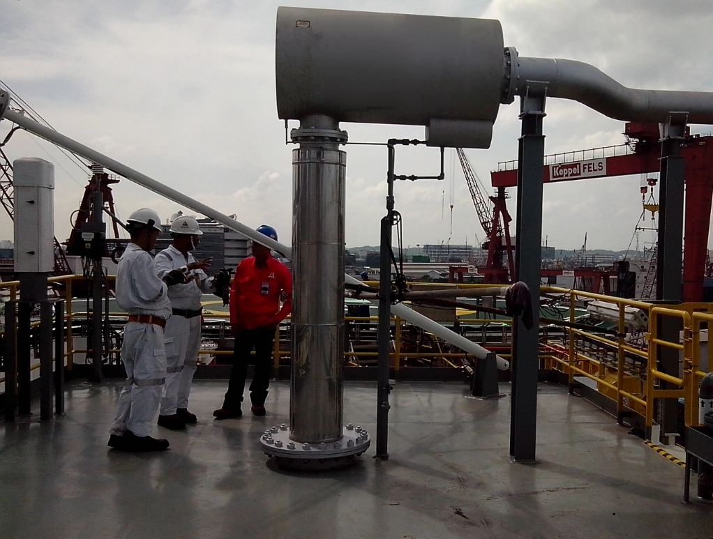 Engineers inspecting exhaust ducting on site